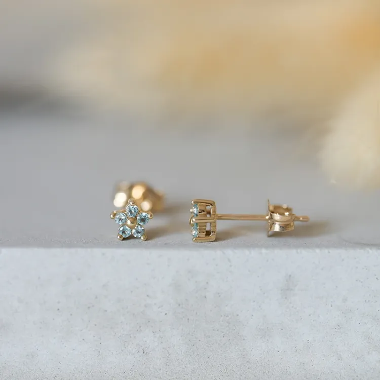 Blommor topas örhängen i 9 karat guld med topaser