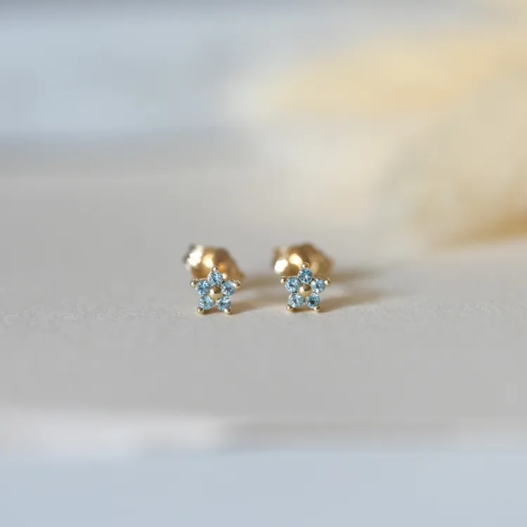 Blommor topas örhängen i 9 karat guld med topaser