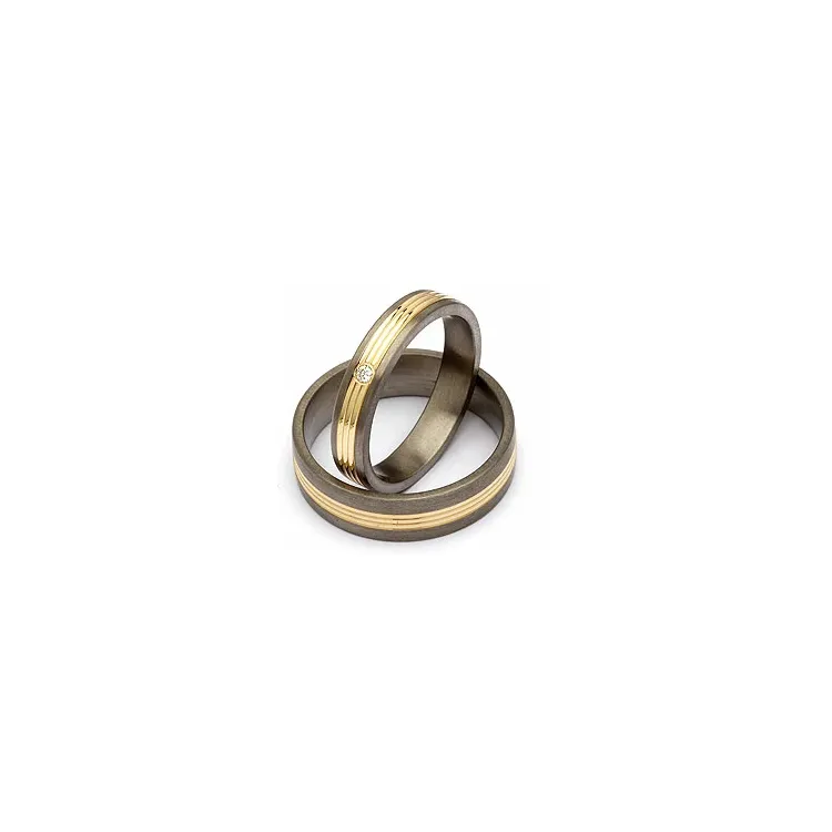 Vigselsringar i titan och vanl. Guld 0,025 ct