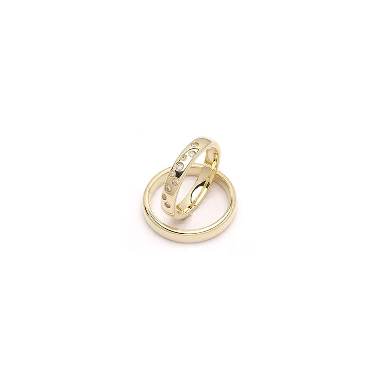 stjärnskimmer vigselsringar i 9 karat guld 0,126 ct - set