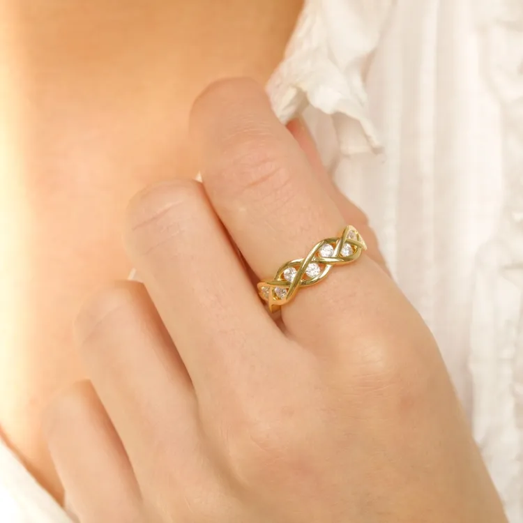 Flätat zirkon ring i förgyllt silver