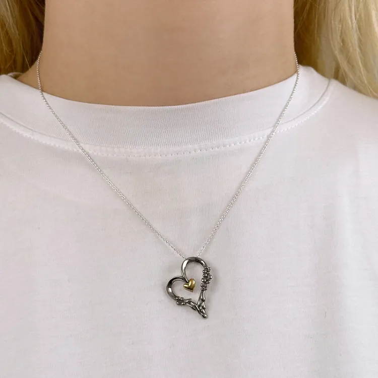 Dark Harmony hjärta hängen i svart rhodinerat silver och förgyllt silver