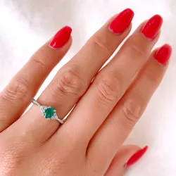 oval smaragd diamantring i 14  karat vitguld 0,47 ct 0,10 ct
