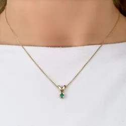 grön smaragd hängen i 14  carat guld 0,22 ct