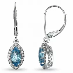 ovala långa blå topas diamantörhängen i 14 karat vitguld med diamant och topas 