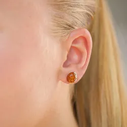 ovala bärnsten örhängestift i förgyllt silver