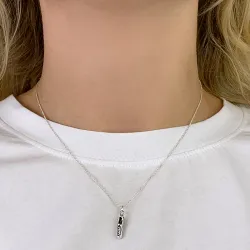 fotbollsskor hängen i rhodinerat silver