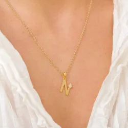 bokstav n hängen i förgyllt silver