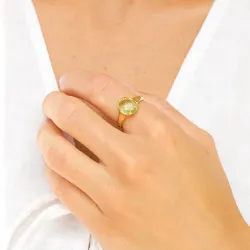 ljusgrön kristal ring i förgylld mässing