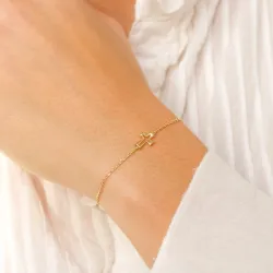 kors armband i förgyllt silver