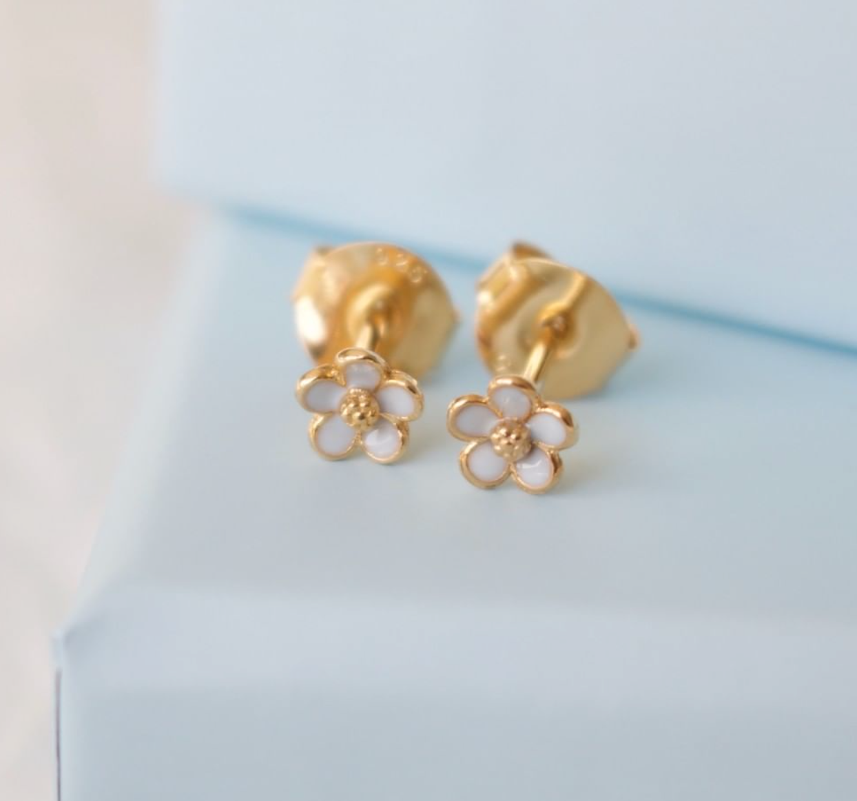 små tusensköna örhängen